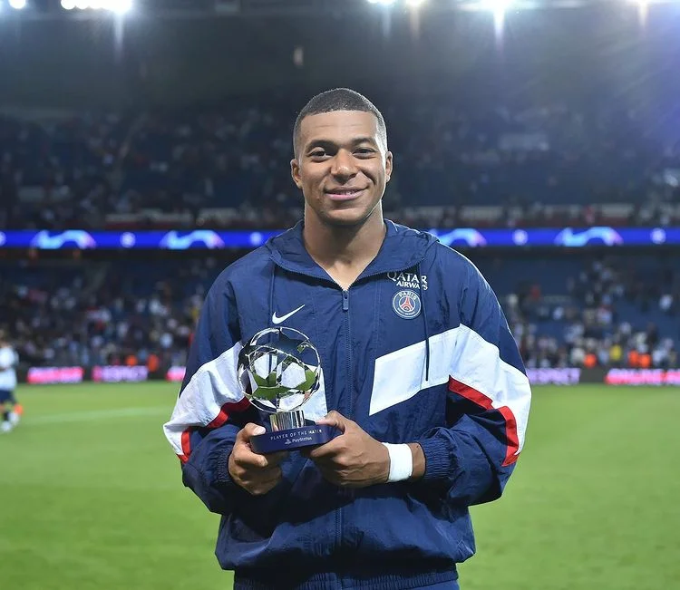 Kylian Mbappe with cup